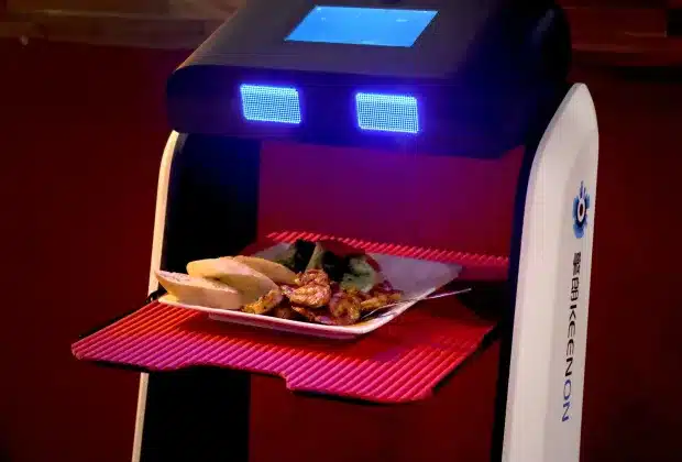 Mr Q’s Crab House, a Hollywood Florida seafood restaurant, introduced robots in 2021 to greet customers and for touchless, socially distanced ordering. A robot on wheels greets patrons as they enter the dining room, and presents menus on a tray, and drops off food and drink at a table. (MIke Stocker/South Florida Sun Sentinel file)